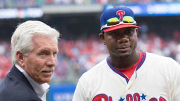 Oct 2, 2016; Philadelphia, PA, USA; Philadelphia Phillies first baseman Ryan Howard (6) is presented a Phillies great Mike Schmidt during a pregame ceremony before action against the New York Mets at Citizens Bank Park. Mandatory Credit: Bill Streicher-USA TODAY Sports