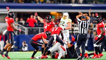 ARLINGTON, TX - NOVEMBER 25: The Texas Tech Red Raiders defense recovers a fumble during the first half of the game against the Baylor Bears on November 25, 2016 at AT