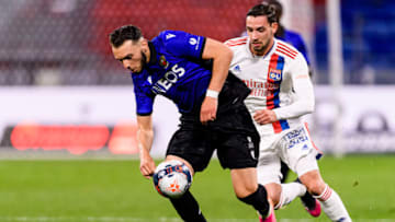 LYON, FRANCE - MAY 23: Amine Gouiri of Nice (L) is chased by Mattia de Sciglio of Olympique Lyon (R) during the Ligue 1 match between Olympique Lyon and OGC Nice at Groupama Stadium on May 23, 2021 in Lyon, France. (Photo by Marcio Machado/Eurasia Sport Images/Getty Images)