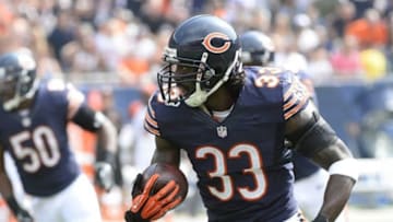 Sep 8, 2013; Chicago, IL, USA; Chicago Bears cornerback Charles Tillman (33) makes an interception against the Cincinnati Bengals during the first quarter at Soldier Field. Mandatory Credit: Mike DiNovo-USA TODAY Sports