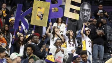 Nov 18, 2014; Atlanta, GA, USA; Fans of Los Angeles Lakers guard Kobe Bryant (not pictured) hold up a sign after the Los Angeles Lakers defeated the Atlanta Hawks at Philips Arena. The Lakers won 114-109. Mandatory Credit: Jason Getz-USA TODAY Sports