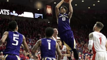 Jan 14, 2016; Tucson, AZ, USA; Washington Huskies forward Marquese Chriss (0) shoots the ball over Arizona Wildcats guard Parker Jackson-Cartwright (0) and center Kaleb Tarczewski (35) (back) during the first half at McKale Center. Mandatory Credit: Casey Sapio-USA TODAY Sports