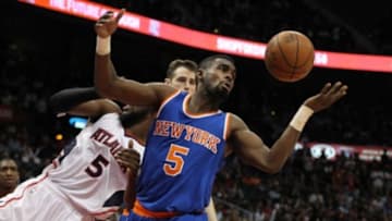 Apr 13, 2015; Atlanta, GA, USA; New York Knicks guard Tim Hardaway Jr. (5) grabs a loose ball against the Atlanta Hawks in the third quarter at Philips Arena. Mandatory Credit: Brett Davis-USA TODAY Sports