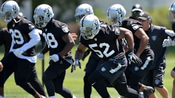 Jun 15, 2016; Alameda, CA, USA; Oakland Raiders defensive end Khalil Mack (52), cornerback T.J. Carrie (38) and cornerback David Amerson (29) at minicamp at the Raiders practice facility. Mandatory Credit: Kirby Lee-USA TODAY Sports