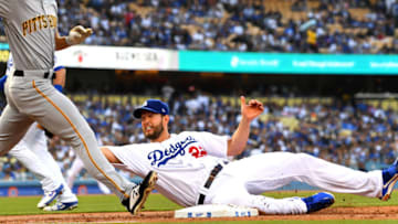 LOS ANGELES, CA - APRIL 27: Clayton Kershaw #22 of the Los Angeles Dodgers hangs on to the ball as he tags out Bryan Reynolds #10 of the Pittsburgh Pirates in the second inning of the game at Dodger Stadium on April 27, 2019 in Los Angeles, California. (Photo by Jayne Kamin-Oncea/Getty Images)
