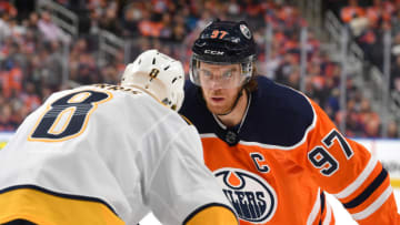 EDMONTON, AB - FEBRUARY 8: Connor McDavid #97 of the Edmonton Oilers lines up for a face off against Kyle Turris #8 of the Nashville Predators on February 8, 2020, at Rogers Place in Edmonton, Alberta, Canada. (Photo by Andy Devlin/NHLI via Getty Images)