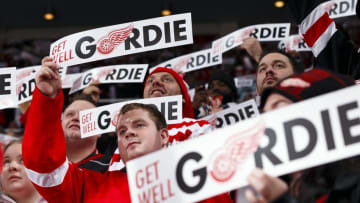 Oct 31, 2014; Detroit, MI, USA; Fans hold up signs for former Detroit Red Wing player Gordie Howe in the first period of the game between the Detroit Red Wings and the Los Angeles Kings at Joe Louis Arena. Mandatory Credit: Rick Osentoski-USA TODAY Sports