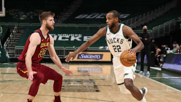 Jan 9, 2021; Milwaukee, WI, USA; Milwaukee Bucks forward Khris Middleton (22) is defended by Cleveland Cavaliers forward Dean Wade (32) at the Bradley Center. Mandatory Credit: Nick Monroe/Handout Photo via USA TODAY Sports
