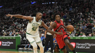 Oct 9, 2021; Boston, Massachusetts, USA; Toronto Raptors forward OG Anunoby (3) drives to the basket past Boston Celtics center Al Horford (42) during the first half at TD Garden. Mandatory Credit: Bob DeChiara-USA TODAY Sports