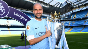 MANCHESTER, ENGLAND - MAY 06: Josep Guardiola, Manager of Manchester City poses with The Premier League Trophy after the Premier League match between Manchester City and Huddersfield Town at Etihad Stadium on May 6, 2018 in Manchester, England. (Photo by Michael Regan/Getty Images)