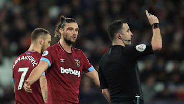 LONDON, ENGLAND - JANUARY 02: Andy Carroll of West Ham United confronts referee Christopher Kavanagh after recieving a cut to the head during the Premier League match between West Ham United and Brighton & Hove Albion at London Stadium on January 2, 2019 in London, United Kingdom. (Photo by Marc Atkins/Getty Images)