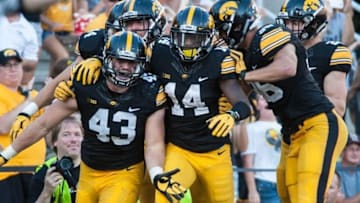 Sep 26, 2015; Iowa City, IA, USA; Iowa Hawkeyes linebacker Josey Jewell (43) and defensive back Desmond King (14) celebrate an interception return for touchdown during the second half against the North Texas Mean Green at Kinnick Stadium. The Hawkeyes won 62-16. Mandatory Credit: Jeffrey Becker-USA TODAY Sports