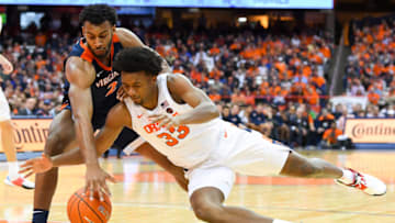 SYRACUSE, NY - NOVEMBER 06: Braxton Key #2 of the Virginia Cavaliers and Elijah Hughes #33 of the Syracuse Orange battle for a loose ball during the second half at the Carrier Dome on November 6, 2019 in Syracuse, New York. Virginia defeated Syracuse 48-34. (Photo by Rich Barnes/Getty Images)