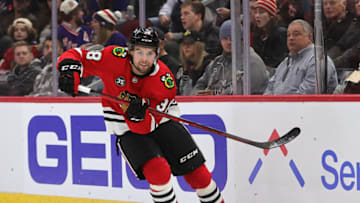 CHICAGO, ILLINOIS - DECEMBER 07: Brandon Hagel #38 of the Chicago Blackhawks chases the puck against the New York Rangers at the United Center on December 07, 2021 in Chicago, Illinois. The Rangers defeated the Blackhawks 6-2. (Photo by Jonathan Daniel/Getty Images)