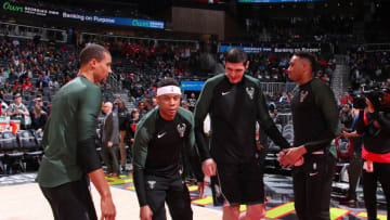ATLANTA, GA - MARCH 31: Tim Frazier #12 and Ersan Ilyasova #77 of the Milwaukee Bucks make their entrance before the game against the Atlanta Hawks on March 31, 2019 at State Farm Arena in Atlanta, Georgia. NOTE TO USER: User expressly acknowledges and agrees that, by downloading and/or using this Photograph, user is consenting to the terms and conditions of the Getty Images License Agreement. Mandatory Copyright Notice: Copyright 2019 NBAE (Photo by Jasear Thompson/NBAE via Getty Images)