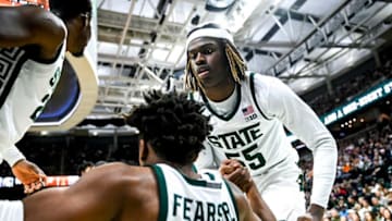 Michigan State's Mady Sissoko, left, and Coen Carr, right, help up teammate Jeremy Fears Jr. during the second half in the game against Tennessee on Sunday, Oct. 29, 2023, at the Breslin Center in East Lansing.