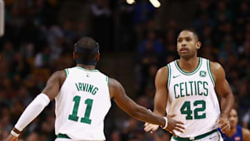 BOSTON, MA - NOVEMBER 27: Al Horford #42 and Kyrie Irving #11 of the Boston Celtics low five during the game against the Detroit Pistons at TD Garden on November 27, 2017 in Boston, Massachusetts. NOTE TO USER: User expressly acknowledges and agrees that, by downloading and or using this photograph, User is consenting to the terms and conditions of the Getty Images License Agreement. (Photo by Omar Rawlings/Getty Images)