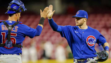 Chicago Cubs left fielder Ian Happ high fives catcher Yan Gomes after win over the Cincinnati Reds at Great American Ball Park. USA Today.