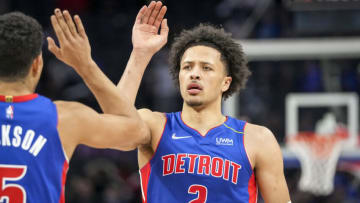 Frank Jackson #5 high fives Cade Cunningham #2 of the Detroit Pistons (Photo by Nic Antaya/Getty Images)