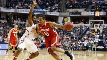 Mar 14, 2014; Indianapolis, IN, USA; Ohio State Buckeyes forward LaQuinton Ross (10) drives to the basket against Nebraska Cornhuskers guard Benny Parker (3) in the quarterfinals of the Big Ten college basketball tournament at Bankers Life Fieldhouse. Ohio State defeats Nebraska 71-67. Mandatory Credit: Brian Spurlock-USA TODAY Sports
