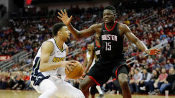 HOUSTON, TX - FEBRUARY 09: Clint Capela #15 of the Houston Rockets defends Jamal Murray #27 of the Denver Nuggets in the second half at Toyota Center on February 9, 2018 in Houston, Texas. NOTE TO USER: User expressly acknowledges and agrees that, by downloading and or using this Photograph, user is consenting to the terms and conditions of the Getty Images License Agreement. (Photo by Tim Warner/Getty Images)