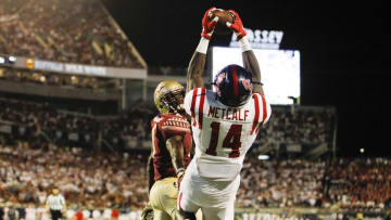Sep 5, 2016; Orlando, FL, USA; Mississippi Rebels wide receiver D.K. Metcalf (14) catches a touchdown pass as Florida State Seminoles defensive back Tarvarus McFadden (4) defends in the second quarter at Camping World Stadium. Mandatory Credit: Logan Bowles-USA TODAY Sports