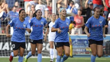 BRIDGEVIEW, ILLINOIS - JULY 21: Sam Kerr #20, Vanessa DiBernardo #10, Julie Ertz #8, and Katie Naughton #5 of Chicago Red Stars celebrate after scoring a goal in the first half against the North Carolina Courage at SeatGeek Stadium on July 21, 2019 in Bridgeview, Illinois. (Photo by Quinn Harris/Getty Images)