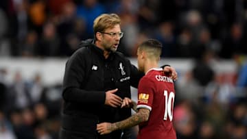 NEWCASTLE UPON TYNE, ENGLAND - OCTOBER 01: Jurgen Klopp, Manager of Liverpool and Philippe Coutinho of Liverpool embrace after the Premier League match between Newcastle United and Liverpool at St. James Park on October 1, 2017 in Newcastle upon Tyne, England. (Photo by Stu Forster/Getty Images)