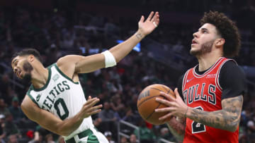 BOSTON, MA - NOVEMBER 01: Lonzo Ball #2 of the Chicago Bulls was called for an offensive foul on this play against Jayson Tatum #0 of the Boston Celtics at TD Garden on November 1, 2021 in Boston, Massachusetts. NOTE TO USER: User expressly acknowledges and agrees that, by downloading and or using this photograph, User is consenting to the terms and conditions of the Getty Images License Agreement. (Photo by Adam Glanzman/Getty Images)