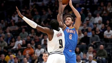 OKC Thunder's Danilo Gallinari #8 puts up a shot over Jerami Grant #9 (Photo by Matthew Stockman/Getty Images)