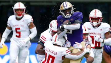Sep 18, 2021; Seattle, Washington, USA; Washington Huskies running back Richard Newton (6) runs the ball against the Arkansas State Red Wolves during the third quarter at Alaska Airlines Field at Husky Stadium. Mandatory Credit: Joe Nicholson-USA TODAY Sports