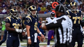 Sep 7, 2014; St. Louis, MO, USA; St. Louis Rams quarterback Austin Davis (9) reacts to a false start penalty called by head linesman Patrick Turner (13) during the second half against the Minnesota Vikings at the Edward Jones Dome. The Minnesota Vikings defeat St. Louis Rams 34-6. Mandatory Credit: Jasen Vinlove-USA TODAY Sports