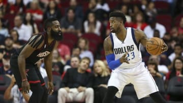 Oct 30, 2016; Houston, TX, USA; Dallas Mavericks guard Wesley Matthews (23) controls the ball as Houston Rockets guard James Harden (13) defends during the first quarter at Toyota Center. Mandatory Credit: Troy Taormina-USA TODAY Sports