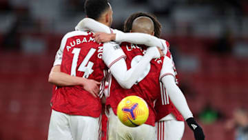 Arsenal's Gabonese striker Pierre-Emerick Aubameyang (L) celebrates scoring his team's third goal during the English Premier League football match between Arsenal and Newcastle United at the Emirates Stadium in London on January 18, 2021. (Photo by Catherine Ivill / POOL / AFP) / RESTRICTED TO EDITORIAL USE. No use with unauthorized audio, video, data, fixture lists, club/league logos or 'live' services. Online in-match use limited to 120 images. An additional 40 images may be used in extra time. No video emulation. Social media in-match use limited to 120 images. An additional 40 images may be used in extra time. No use in betting publications, games or single club/league/player publications. / (Photo by CATHERINE IVILL/POOL/AFP via Getty Images)