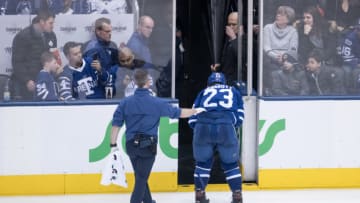TORONTO, ON - FEBRUARY 27: Toronto Maple Leafs Defenceman Travis Dermott (23) leaves the ice with an injury during the third period of the NHL regular season game between the Edmonton Oilers and the Toronto Maple Leafs on February 27, 2019, at Scotiabank Arena in Toronto, ON, Canada. (Photo by Julian Avram/Icon Sportswire via Getty Images)