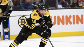 Oct 16, 2021; Boston, Massachusetts, USA; Boston Bruins right wing Craig Smith (12) controls the puck during the third period against the Dallas Stars at TD Garden. Mandatory Credit: Bob DeChiara-USA TODAY Sports