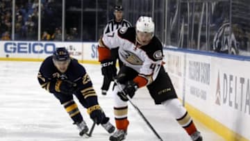 Dec 17, 2015; Buffalo, NY, USA; Buffalo Sabres center Sam Reinhart (23) tries to block a pass by Anaheim Ducks defenseman Hampus Lindholm (47) during the third period at First Niagara Center. Buffalo beats Anaheim 3 to 0. Mandatory Credit: Timothy T. Ludwig-USA TODAY Sports