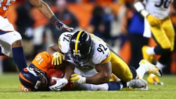 Jan 17, 2016; Denver, CO, USA; Pittsburgh Steelers linebacker James Harrison (92) tackles Denver Broncos wide receiver Bennie Fowler (12) during the AFC Divisional round playoff game at Sports Authority Field at Mile High. Mandatory Credit: Mark J. Rebilas-USA TODAY Sports