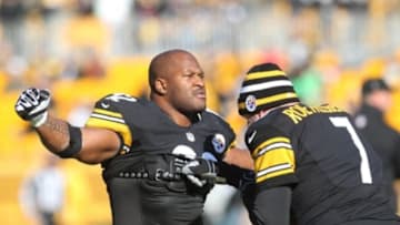 December 23, 2012; Pittsburgh, PA, USA; Pittsburgh Steelers outside linebacker James Harrison (92) and quarterback Ben Roethlisberger (7) interact on the field before playing the Cincinnati Bengals at Heinz Field. The Cincinnati Bengals won 13-10. Mandatory Credit: Charles LeClaire-USA TODAY Sports