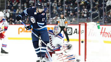 New York Rangers, Igor Shesterkin (31); Winnipeg Jets, Adam Lowry (17). Mandatory Credit: Terrence Lee-USA TODAY Sports
