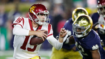 SOUTH BEND, IN - OCTOBER 21: Matt Fink #19 of the USC Trojans runs the ball against Julian Okwara #42 of the Notre Dame Fighting Irish in the third quarter of a game at Notre Dame Stadium on October 21, 2017 in South Bend, Indiana. Notre Dame won 49-14. (Photo by Joe Robbins/Getty Images)