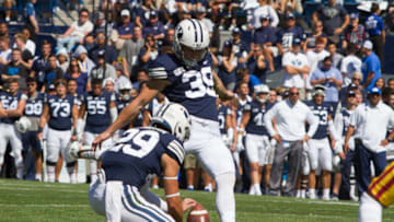 PROVO, UT - SEPTEMBER 14 : Jake Oldroyd #39 of the BYU Cougars kicks the game winning field goal off the hold from Hayden Livingston #29 against the USC Trojans at LaVell Edwards Stadium on September 14, 2019 in Provo, Utah. (Photo by Chris Gardner/Getty Images)