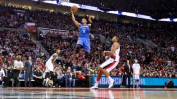 Feb 27, 2015; Portland, OR, USA; Oklahoma City Thunder guard Russell Westbrook (0) shoots over Portland Trail Blazers forward Nicolas Batum (88) during the third quarter at the Moda Center. Mandatory Credit: Craig Mitchelldyer-USA TODAY Sports