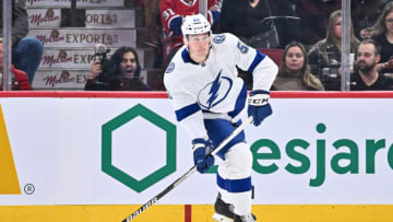 MONTREAL, CANADA - DECEMBER 17: Cal Foote #52 of the Tampa Bay Lightning looks to play the puck during the first period against the Montreal Canadiens at Centre Bell on December 17, 2022 in Montreal, Quebec, Canada. The Tampa Bay Lightning defeated the Montreal Canadiens 5-1. (Photo by Minas Panagiotakis/Getty Images)