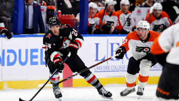 Nov 3, 2023; Buffalo, New York, USA; Philadelphia Flyers left wing Noah Cates (27) tries to block a pass by Buffalo Sabres center Dylan Cozens (24) during the second period at KeyBank Center. Mandatory Credit: Timothy T. Ludwig-USA TODAY Sports