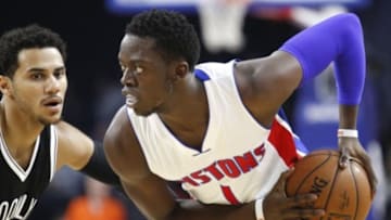 Oct 8, 2015; Auburn Hills, MI, USA; Detroit Pistons guard Reggie Jackson (1) holds the ball as Brooklyn Nets guard Shane Larkin (0) defends during the first quarter at The Palace of Auburn Hills. Mandatory Credit: Raj Mehta-USA TODAY Sports