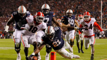 AUBURN, AL - NOVEMBER 11: Kerryon Johnson #21 of the Auburn Tigers dives for a touchdown past Deandre Baker #18 of the Georgia Bulldogs at Jordan Hare Stadium on November 11, 2017 in Auburn, Alabama. (Photo by Kevin C. Cox/Getty Images)