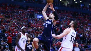 TORONTO, ON - APRIL 23: Nikola Vucevic #9 of the Orlando Magic shoots the ball during Game Five of the first round of the 2019 NBA Playoffs against the Toronto Raptorsat Scotiabank Arena on April 23, 2019 in Toronto, Canada. NOTE TO USER: User expressly acknowledges and agrees that, by downloading and or using this photograph, User is consenting to the terms and conditions of the Getty Images License Agreement. (Photo by Vaughn Ridley/Getty Images)