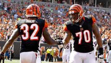 Sep 25, 2016; Cincinnati, OH, USA; Cincinnati Bengals running back Jeremy Hill (32) and offensive tackle Cedric Ogbuehi (70) celebrate in the game against the Denver Broncos in the first half at Paul Brown Stadium. Mandatory Credit: Mark Zerof-USA TODAY Sports