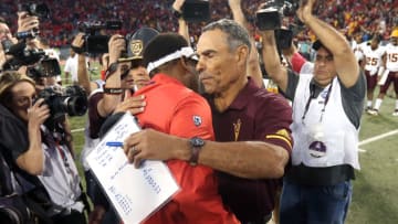 TUCSON, AZ - NOVEMBER 24: Head coach Herm Edwards of the Arizona State Sun Devils (R) embraces head coach Kevin Sumlin of the Arizona Wildcats following a 41-40 ASU victory during the college football game at Arizona Stadium on November 24, 2018 in Tucson, Arizona. (Photo by Ralph Freso/Getty Images)